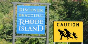 Immigrant crossing sign with Discover Beautiful RI sign