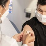 Teenager gets vaccinated