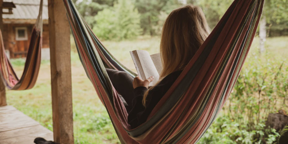 Woman reading in a hammock