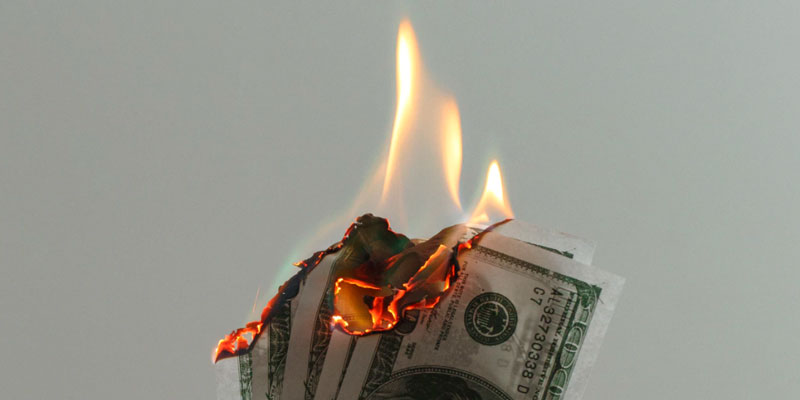Burning $100 bills