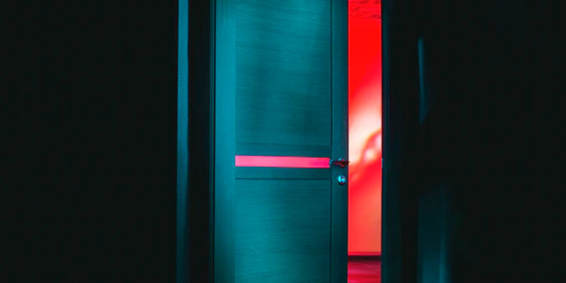 A door open on a red room
