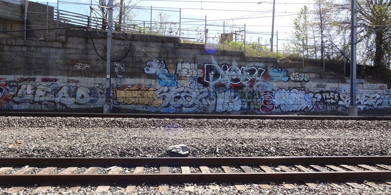 Graffiti by railroad tracks