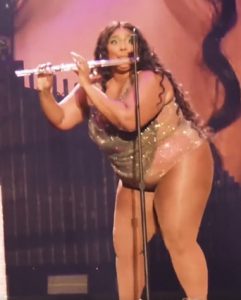 Lizzo crystal flute onstage