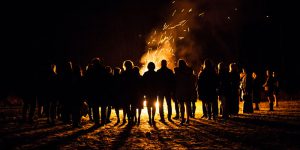 People gathered around a bonfire