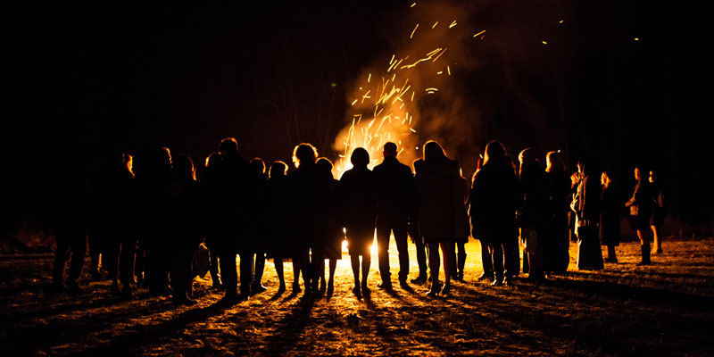 People gathered around a bonfire