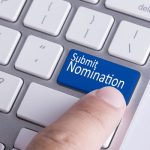 A "Submit Nomination" button on a keyboard