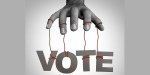The word, "vote," on puppet strings