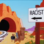 A coyote sets a trap with a fake tunnel and "Racist" sign